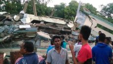 JS115495185_AFP_Residents-gather-around-a-collapsed-buil-large_trans++PSGJeyftEP9WNF5nKPELKUahKogPZjj4nPpGe8Pk4Yc