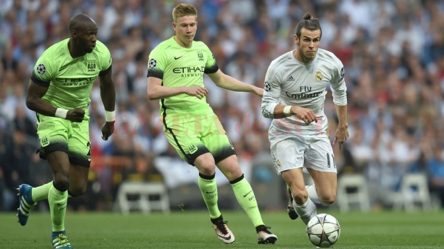 Gareth Bale (la minge) a făcut diferența în semifinala cu „cetățenii” (foto: uefa.com)