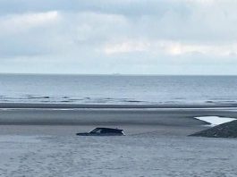 Un român a îngropat un SUV de lux pe plajă, în Belgia