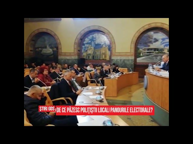 De ce păzesc poliţiştii locali panourile electorale?