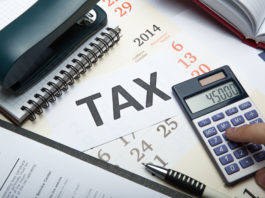 O nouă taxă pentru firme, propusă în Parlament