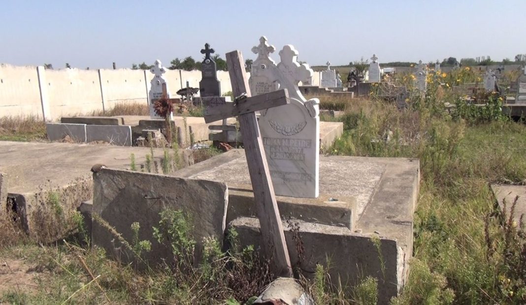 Olt: A murit în timp ce lucra în cimitir