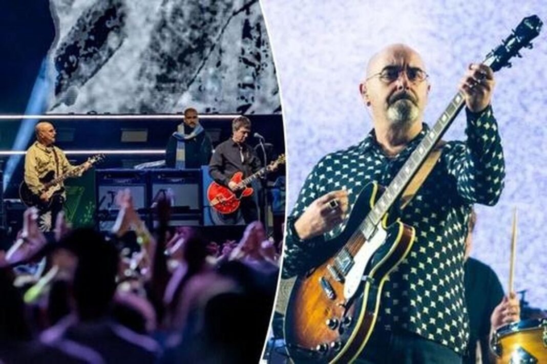 Chitaristul trupei Oasis, Paul Arthurs, se retrage pentru a lupta împotriva cancerului